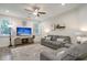Living room with gray sofas, TV, and area rug at 119 Osage Way, Summerville, SC 29483