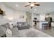 Open living room and kitchen with gray sofas at 119 Osage Way, Summerville, SC 29483