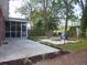 Spacious backyard with fire pit and patio at 1278 S Lenevar Dr, Charleston, SC 29407