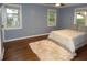 Serene bedroom with hardwood floors and light blue walls at 1278 S Lenevar Dr, Charleston, SC 29407