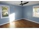 Spacious bedroom with hardwood floors and light blue walls at 1278 S Lenevar Dr, Charleston, SC 29407