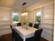 Bright dining room with built-in shelving and chandelier at 1278 S Lenevar Dr, Charleston, SC 29407