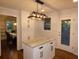 Kitchen island with granite countertop and white shaker cabinets at 1278 S Lenevar Dr, Charleston, SC 29407
