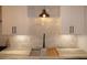 Modern kitchen sink with marble backsplash and black faucet at 1278 S Lenevar Dr, Charleston, SC 29407