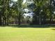 Open green space with a baseball field and trees at 1278 S Lenevar Dr, Charleston, SC 29407