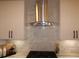Stainless steel range hood above a gas cooktop at 1278 S Lenevar Dr, Charleston, SC 29407
