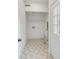 Clean laundry room with geometric tile floor and built-in shelving at 14 Chadwick Dr, Charleston, SC 29407