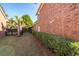 Landscaped backyard with privacy hedge and small grassy area at 1441 Waterside Ct, Mount Pleasant, SC 29464