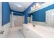 Bright bathroom with white vanity, bathtub, and shower at 1441 Waterside Ct, Mount Pleasant, SC 29464