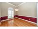 Dining room with hardwood floors and burgundy wainscoting at 1441 Waterside Ct, Mount Pleasant, SC 29464