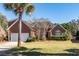 Brick home with two-car garage and manicured lawn at 1441 Waterside Ct, Mount Pleasant, SC 29464