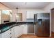 Kitchen boasts granite countertops and stainless steel appliances at 1441 Waterside Ct, Mount Pleasant, SC 29464