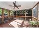 Relaxing screened porch with ceiling fan and access to backyard at 1441 Waterside Ct, Mount Pleasant, SC 29464