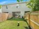 Private backyard with wooden fence, patio, and lush lawn at 148 Pine Shadow Dr, Goose Creek, SC 29445