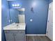 Clean bathroom with vanity, shower, and light gray vinyl flooring at 148 Pine Shadow Dr, Goose Creek, SC 29445