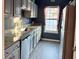 Galley kitchen with granite countertops and stainless steel appliances at 148 Pine Shadow Dr, Goose Creek, SC 29445