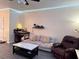 Living room with light grey couch, recliner, and marble-top coffee table at 148 Pine Shadow Dr, Goose Creek, SC 29445