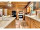 Kitchen with wooden cabinets, white countertops, and a farmhouse sink at 15717 Round O Rd, Round O, SC 29474