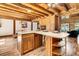 L-shaped kitchen island with wooden cabinets and a large sink at 15717 Round O Rd, Round O, SC 29474