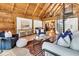 Living area with vaulted wood ceilings and a spiral staircase at 15717 Round O Rd, Round O, SC 29474