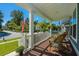 Relaxing front porch with rocking chair and view of the street at 160 Ashley Bluffs Rd, Summerville, SC 29485