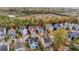 Aerial view of a house and neighborhood with fall foliage and water views at 1944 Gracewood Dr, Charleston, SC 29414