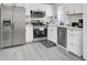 Modern kitchen with stainless steel appliances and white cabinetry at 211 Decoy Ln, Moncks Corner, SC 29461