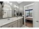 Double vanity bathroom with gray cabinets and marble floors at 213 Oak View Way, Summerville, SC 29483