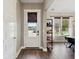 Bright entryway with white door, wood floors, and a modern shelf at 213 Oak View Way, Summerville, SC 29483