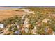 Aerial view of neighborhood with fall foliage near water at 2260 Woodland Shores Rd, Charleston, SC 29412