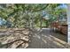 Spacious, tree-filled backyard with a wooden deck at 2305 Myrtle St, Edisto Beach, SC 29438