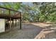 View of a backyard with trees and a wooden deck at 2305 Myrtle St, Edisto Beach, SC 29438