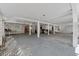 Spacious covered patio with a concrete floor, lattice walls, and a grill at 2305 Myrtle St, Edisto Beach, SC 29438