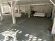 Relaxing covered patio with white wooden swing and seating at 2305 Myrtle St, Edisto Beach, SC 29438