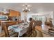 Dining area with a wooden table, chairs, and views of the living room and kitchen at 2305 Myrtle St, Edisto Beach, SC 29438