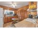 Kitchen with wooden cabinets, white appliances, and a breakfast nook at 2305 Myrtle St, Edisto Beach, SC 29438
