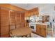 Kitchen featuring wooden cabinets, white appliances, and a cozy breakfast nook at 2305 Myrtle St, Edisto Beach, SC 29438