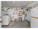 Laundry room with washer, dryer, storage shelves, and a second refrigerator at 2305 Myrtle St, Edisto Beach, SC 29438