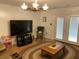 Cozy living room featuring a large TV and comfortable seating at 2305 Myrtle St, Edisto Beach, SC 29438