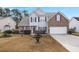 Two-story brick house with a gray vinyl siding and a white garage door at 235 Pemberly Boulevard, Summerville, SC 29486