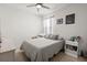 Bedroom with gray bedding, nightstand, and window curtains at 280 W Bradford Pointe Dr, Summerville, SC 29486