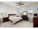 Bright bedroom with carpeted floors, a queen-size bed, and plenty of natural light at 282 Woodland Oak Way, Summerville, SC 29485