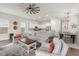 Open living room featuring hardwood floors, neutral color palette, and ample natural light at 282 Woodland Oak Way, Summerville, SC 29485