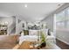 Open living room with white slipcovered sofas and wood floors at 376 Azore Way, Summerville, SC 29486