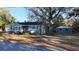 Charming gray house with a detached garage and mature trees at 412 Live Oak St, Walterboro, SC 29488