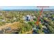 Aerial view of home nestled in a tree-lined neighborhood near the water at 46 Chadwick Dr, Charleston, SC 29407