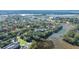 Aerial view of a neighborhood with waterfront access and fall colors at 46 Chadwick Dr, Charleston, SC 29407
