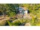 Aerial view of a house with mature trees and landscaping at 46 Chadwick Dr, Charleston, SC 29407