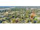 Aerial view showcasing a home nestled in a tree-lined neighborhood near the water at 46 Chadwick Dr, Charleston, SC 29407