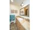 Updated bathroom with beige tile, a large mirror, and double vanity at 46 Chadwick Dr, Charleston, SC 29407